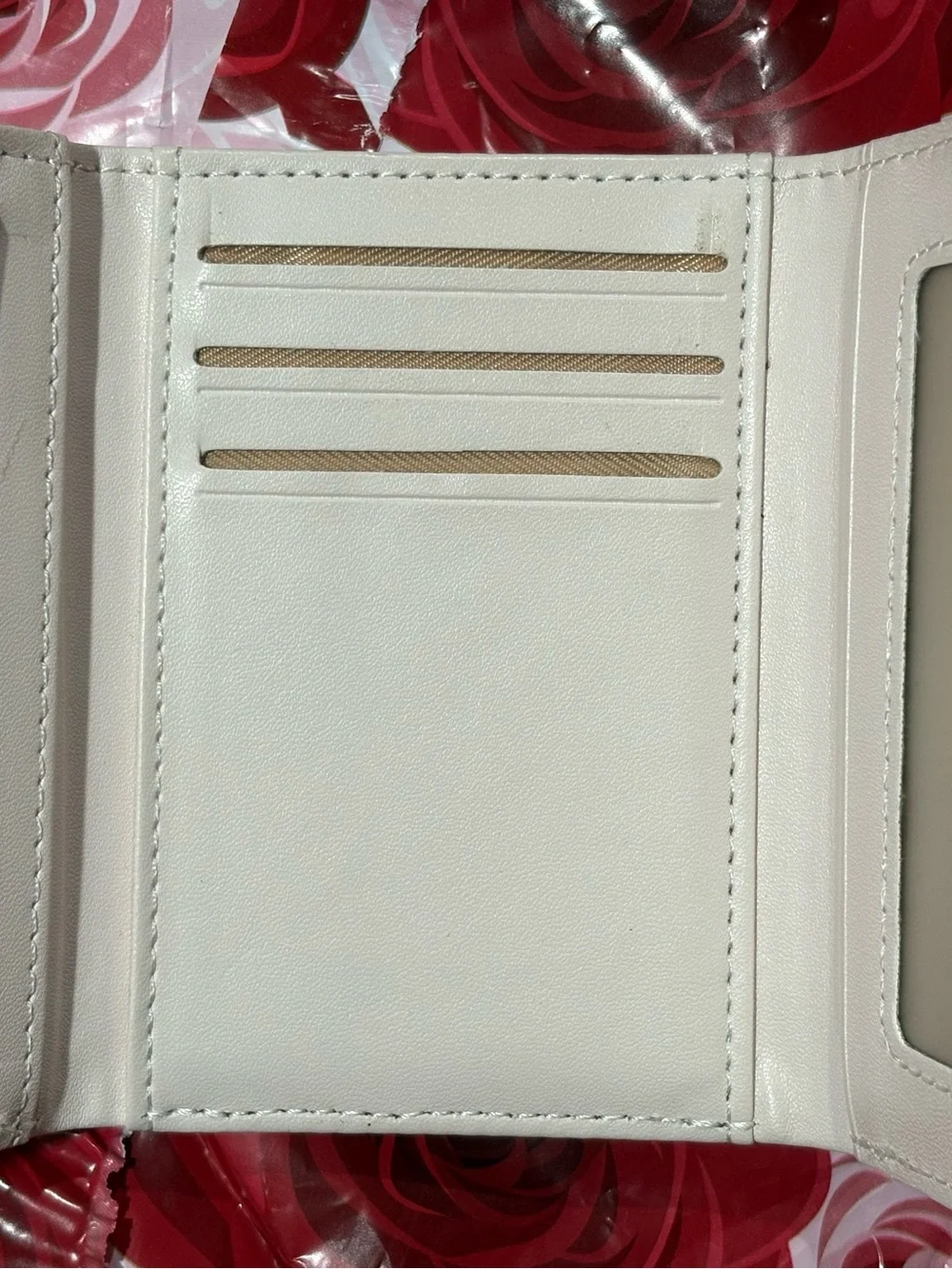 Adorable rabbit-print kids wallet in light pink and white. Durable faux leather